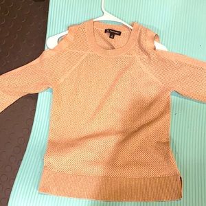 Unique sweater-bow cuffs and exposed shoulders